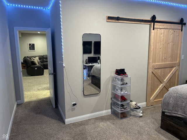 12059 Chapelwood Dr, Fishers, IN 46037 - bedroom with a barn door and carpet flooring
