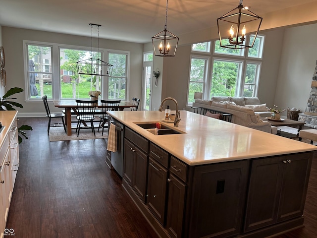 12059 Chapelwood Dr, Fishers, IN 46037 - kitchen featuring a chandelier, dishwasher, light countertops, and dark wood finished floors