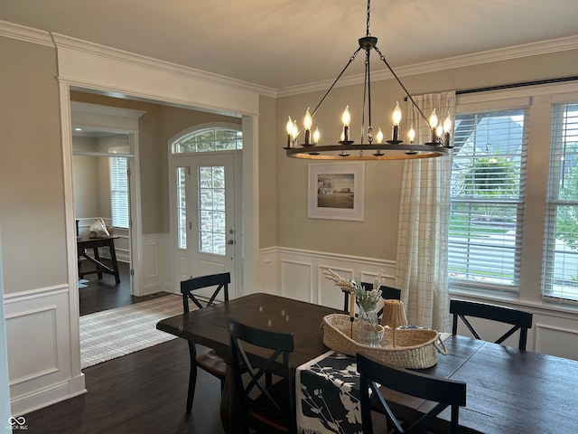 12059 Chapelwood Dr, Fishers, IN 46037 - dining area featuring a chandelier, a decorative wall, plenty of natural light, ornamental molding, and dark wood-style flooring
