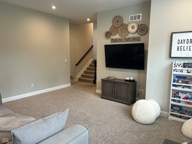 12059 Chapelwood Dr, Fishers, IN 46037 - carpeted living room featuring stairs and recessed lighting