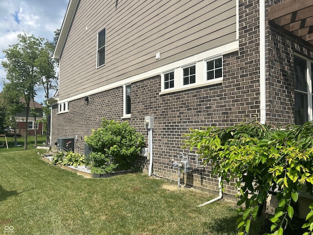 12059 Chapelwood Dr, Fishers, IN 46037 - view of side of home with a lawn and brick siding