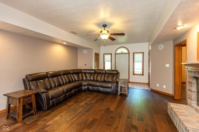 9437 N County Road 225 E, Pittsboro, IN 46167 - living area with ceiling fan, dark wood finished floors, a textured ceiling, and a fireplace