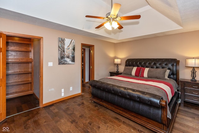 9437 N County Road 225 E, Pittsboro, IN 46167 - bedroom featuring wood finished floors, a raised ceiling, and a ceiling fan