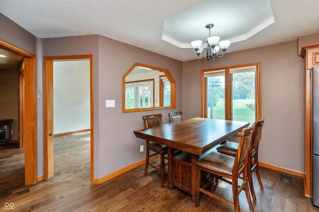 9437 N County Road 225 E, Pittsboro, IN 46167 - dining area featuring a chandelier, wood finished floors, and a raised ceiling