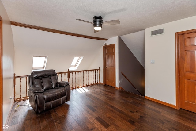 9437 N County Road 225 E, Pittsboro, IN 46167 - living area featuring an upstairs landing, dark wood-style floors, a textured ceiling, a ceiling fan, and crown molding