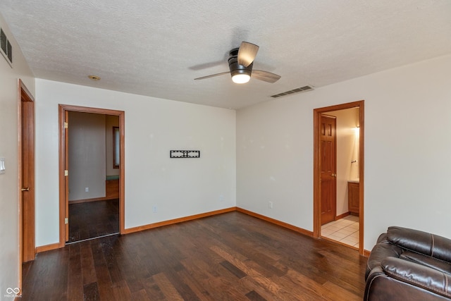 9437 N County Road 225 E, Pittsboro, IN 46167 - unfurnished living room with wood finished floors, ceiling fan, and a textured ceiling
