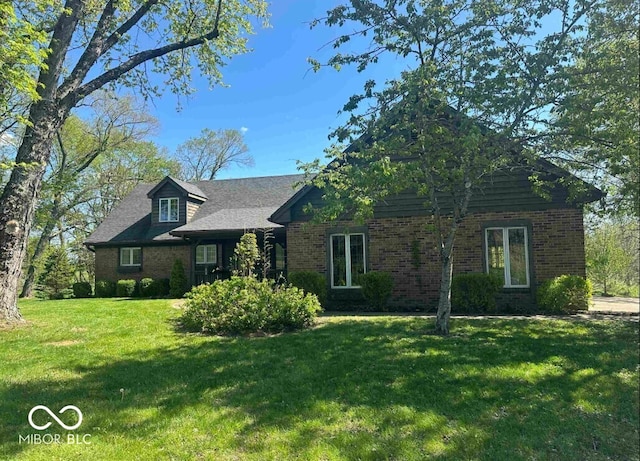 98 E Smithville Rd, Bloomington, IN 47401 - view of front of home with brick siding and a front yard