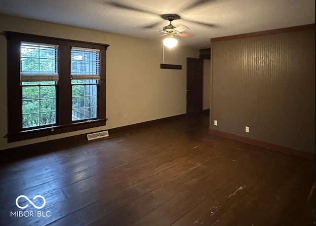 98 E Smithville Rd, Bloomington, IN 47401 - empty room featuring ceiling fan and dark wood-style floors