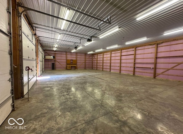 98 E Smithville Rd, Bloomington, IN 47401 - garage featuring a garage door opener