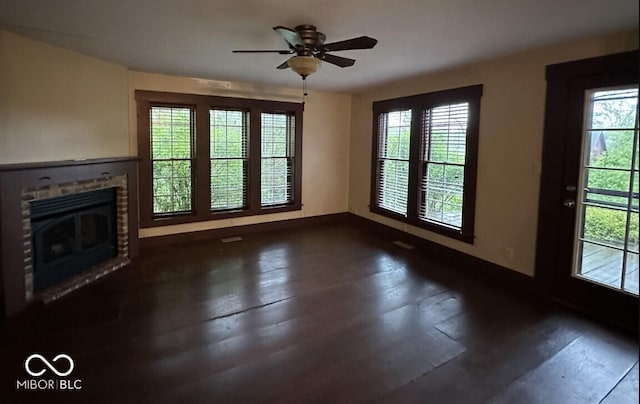 98 E Smithville Rd, Bloomington, IN 47401 - unfurnished living room featuring plenty of natural light, a fireplace, and a ceiling fan