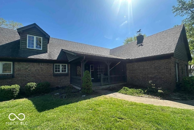 98 E Smithville Rd, Bloomington, IN 47401 - rear view of house featuring brick siding, a lawn, a porch, and a chimney
