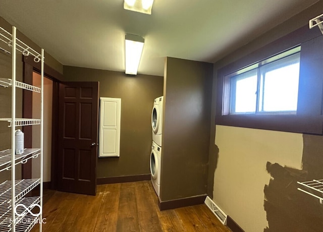 98 E Smithville Rd, Bloomington, IN 47401 - corridor with stacked washer and clothes dryer and wood finished floors