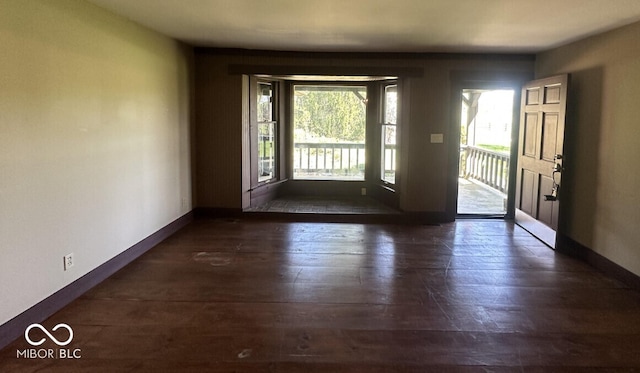 98 E Smithville Rd, Bloomington, IN 47401 - entryway featuring baseboards and hardwood / wood-style floors