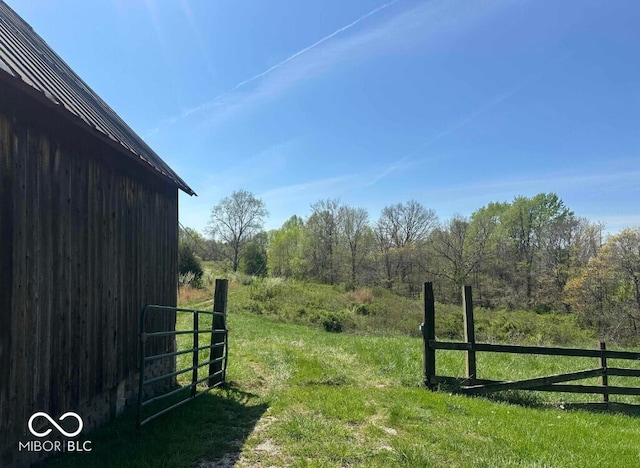 98 E Smithville Rd, Bloomington, IN 47401 - view of yard featuring a wooded view