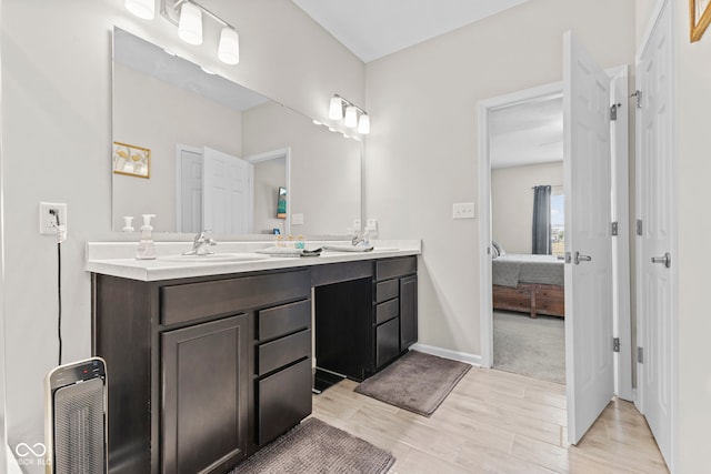 1448 Willow Tree Ln, Sheridan, IN 46069 - full bathroom featuring double vanity, connected bathroom, and wood finished floors
