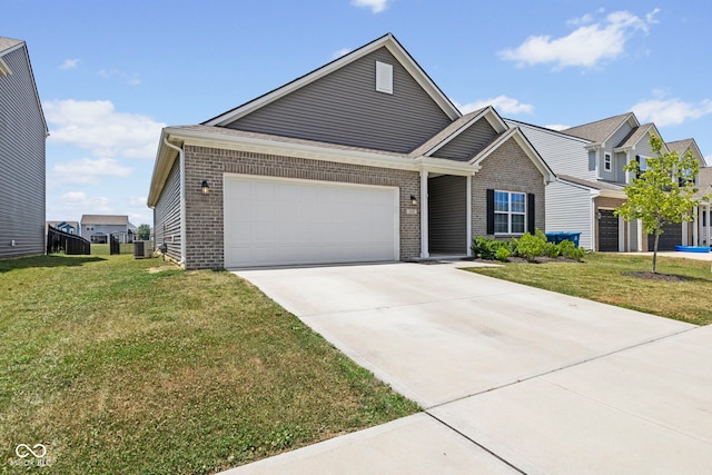 1448 Willow Tree Ln, Sheridan, IN 46069 - view of front of property with brick siding, a garage, driveway, and a front yard