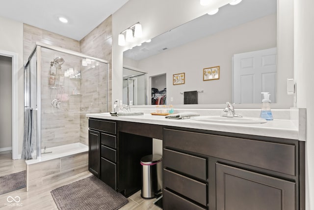 1448 Willow Tree Ln, Sheridan, IN 46069 - full bathroom featuring double vanity, a shower stall, a walk in closet, and recessed lighting