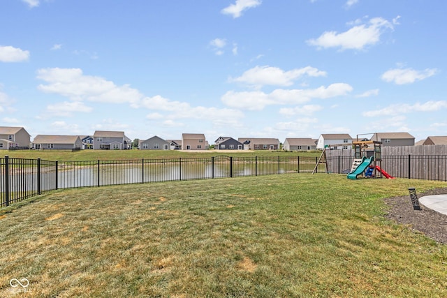 1448 Willow Tree Ln, Sheridan, IN 46069 - fenced backyard featuring a residential view, a playground, and a water view