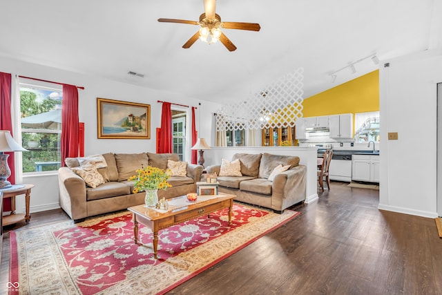 1058 Creekwood Ln, Franklin, IN 46131 - living room featuring dark wood-style flooring, a ceiling fan, and vaulted ceiling
