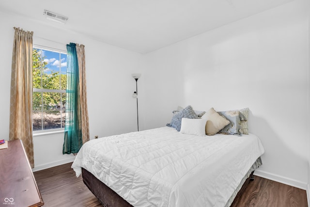 1058 Creekwood Ln, Franklin, IN 46131 - bedroom featuring baseboards and wood finished floors
