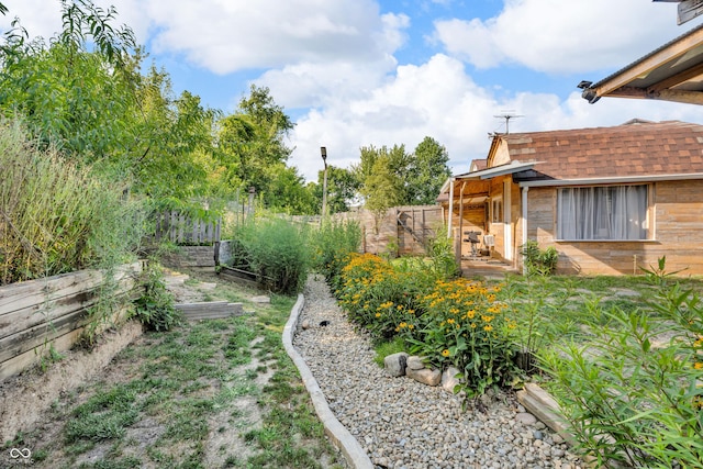 1058 Creekwood Ln, Franklin, IN 46131 - fenced backyard with a garden