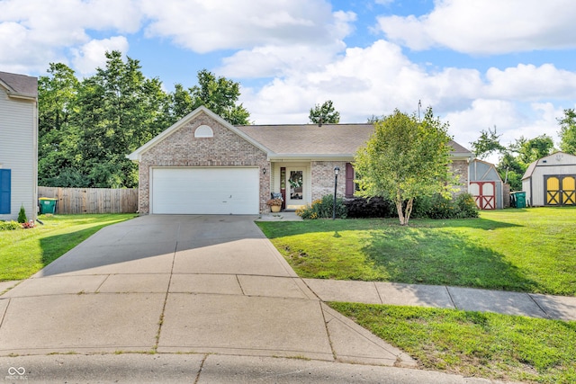 1058 Creekwood Ln, Franklin, IN 46131 - view of front facade with a shed, driveway, an attached garage, brick siding, and a shingled roof