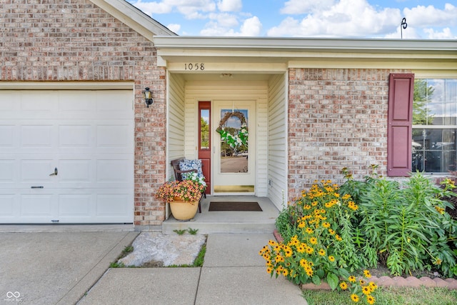 1058 Creekwood Ln, Franklin, IN 46131 - entrance to property with brick siding, a garage, and concrete driveway