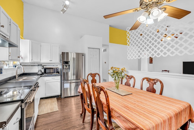 1058 Creekwood Ln, Franklin, IN 46131 - dining room featuring ceiling fan, dark wood-style flooring, and a towering ceiling