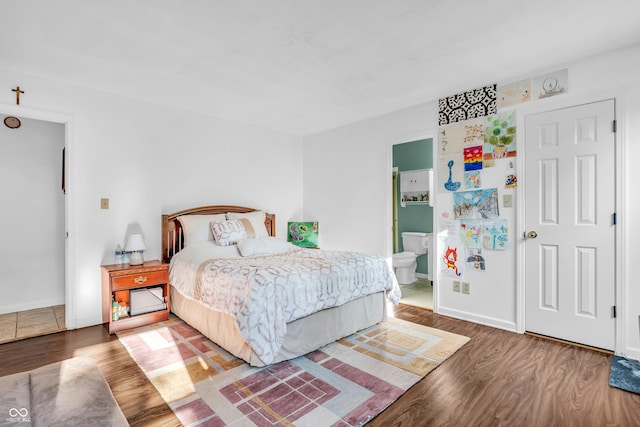 1058 Creekwood Ln, Franklin, IN 46131 - bedroom with wood finished floors and ensuite bath