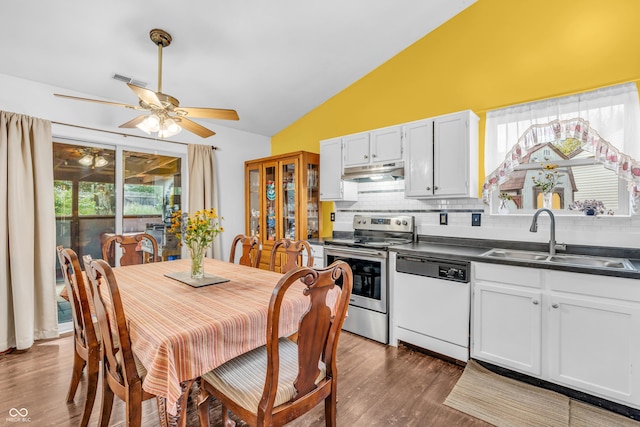 1058 Creekwood Ln, Franklin, IN 46131 - kitchen featuring dishwasher, stainless steel electric range oven, lofted ceiling, under cabinet range hood, and dark countertops