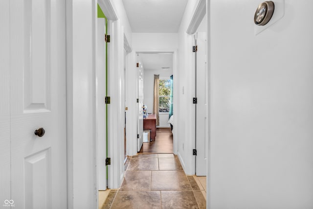1058 Creekwood Ln, Franklin, IN 46131 - hallway with baseboards and light stone finish floors