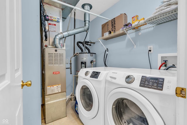 1058 Creekwood Ln, Franklin, IN 46131 - washroom featuring washing machine and clothes dryer and tile patterned flooring