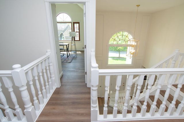 10630 Thorny Rdg Trce, Fishers, IN 46037 - hallway featuring plenty of natural light, wood finished floors, and an upstairs landing