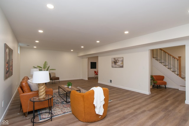 10630 Thorny Rdg Trce, Fishers, IN 46037 - living area featuring wood finished floors, recessed lighting, and stairs