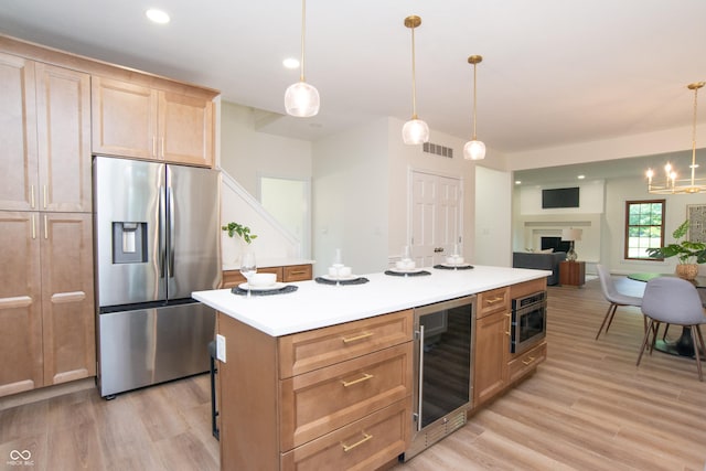 10630 Thorny Rdg Trce, Fishers, IN 46037 - kitchen featuring stainless steel fridge with ice dispenser, wine cooler, light wood-type flooring, a kitchen island, and recessed lighting