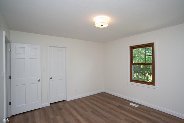 10630 Thorny Rdg Trce, Fishers, IN 46037 - unfurnished bedroom with dark wood-style flooring