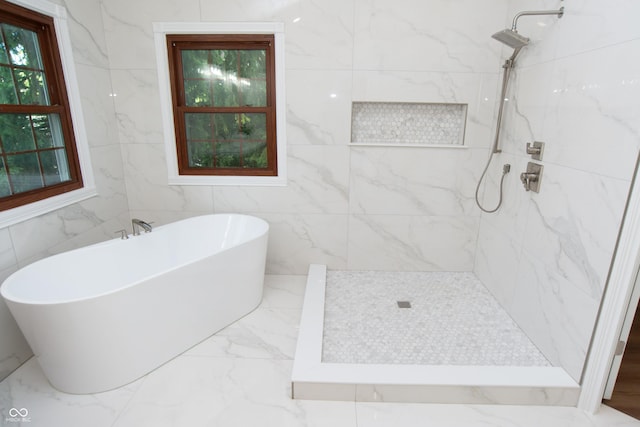10630 Thorny Rdg Trce, Fishers, IN 46037 - full bathroom with a freestanding tub, a marble finish shower, and marble tiled floors