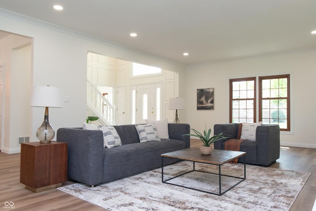10630 Thorny Rdg Trce, Fishers, IN 46037 - living area featuring ornamental molding, wood finished floors, stairs, and recessed lighting