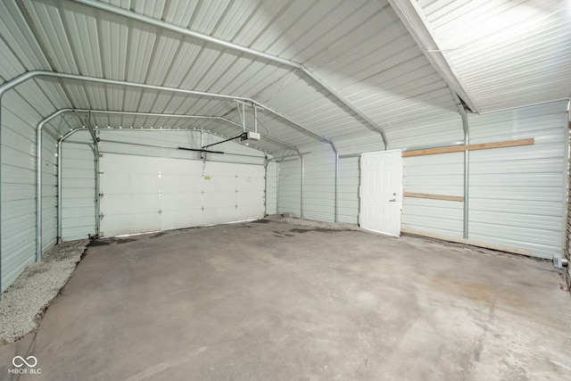 107 Pasadena Rd, Noblesville, IN 46062 - garage featuring a garage door opener and metal wall