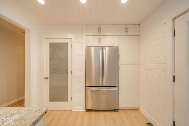 107 Pasadena Rd, Noblesville, IN 46062 - kitchen with freestanding refrigerator, recessed lighting, light wood finished floors, white cabinets, and light countertops
