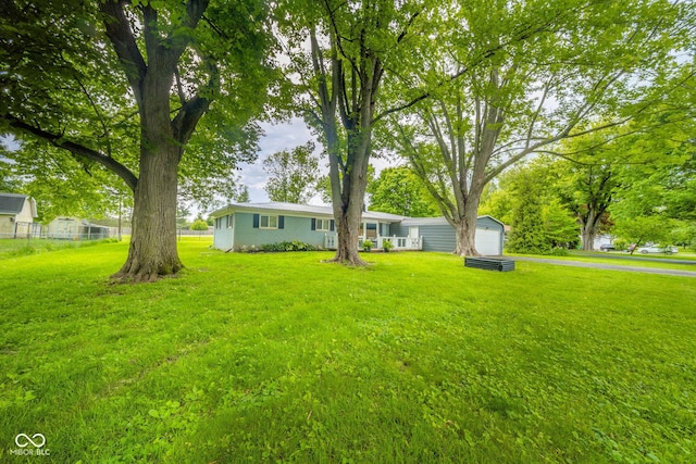 107 Pasadena Rd, Noblesville, IN 46062 - view of yard with a detached garage