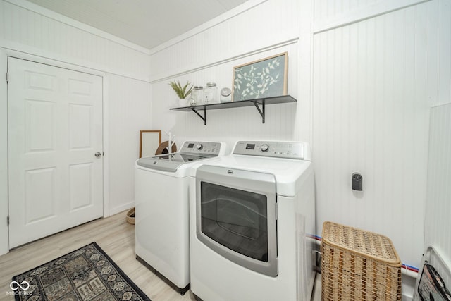 107 Pasadena Rd, Noblesville, IN 46062 - washroom featuring separate washer and dryer, crown molding, and light wood-style flooring