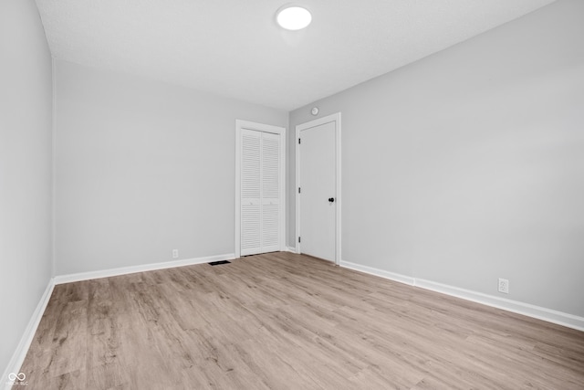 184 N Post Rd, Indianapolis, IN 46219 - unfurnished room with wood finished floors and baseboards