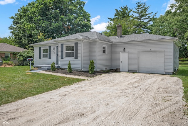 184 N Post Rd, Indianapolis, IN 46219 - ranch-style home with an attached garage, driveway, a chimney, and a front lawn