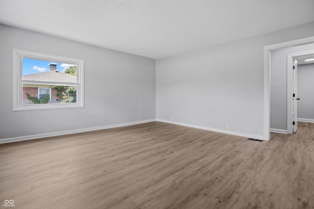 184 N Post Rd, Indianapolis, IN 46219 - unfurnished room featuring wood finished floors