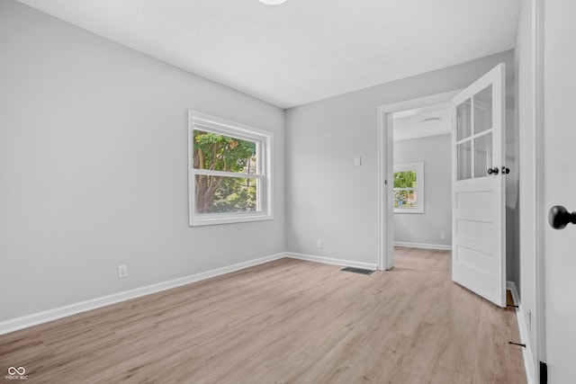 184 N Post Rd, Indianapolis, IN 46219 - spare room featuring light wood finished floors and baseboards