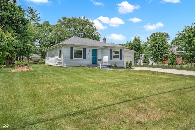 184 N Post Rd, Indianapolis, IN 46219 - view of front of home with an attached garage, driveway, and a chimney