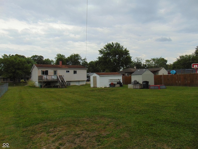 4546 Laclede St, Indianapolis, IN 46221 - view of yard with a storage shed, a wooden deck, and stairway