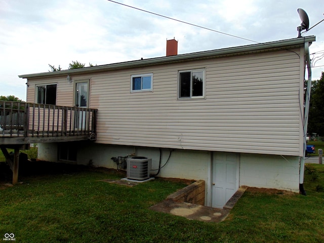 4546 Laclede St, Indianapolis, IN 46221 - back of house with a wooden deck, a yard, and a chimney