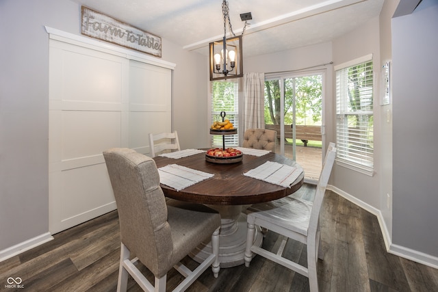 14126 Stonewood Pl, Fishers, IN 46037 - dining area with a chandelier and dark wood-style floors